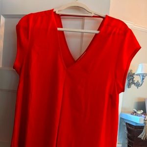 Bright orange blouse